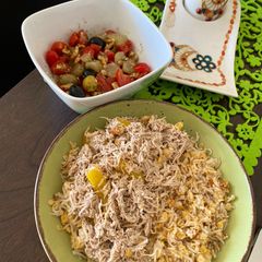 A picture of Healthy lunch Lentil with rice called Koshri and Chicken, salad.