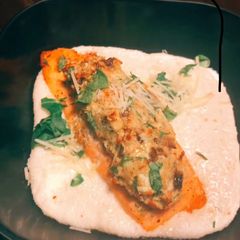 Spinach Stuffed Salmon /Parmesan Goat Cheese Grits A picture of Spinach Stuffed Salmon /Parmesan Goat Cheese Grits.