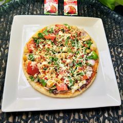 Spinach Kabuli Pizza A picture of Spinach Kabuli Pizza.