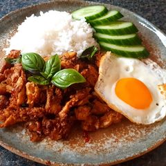 A picture of Spicy Vegetarian Chicken with Basil Leaves and Sunny Side Up Egg - Kraprao Kai, Khai Dow.
