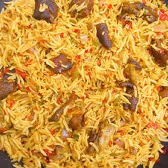 A picture of Peppered Goat Meat (Asun) Rice.