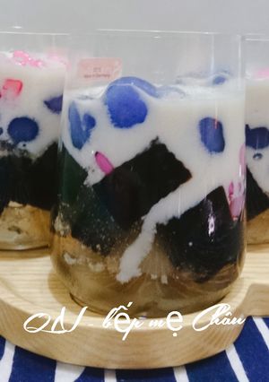 A picture of Grass Jelly Dessert with Water Chestnut, Tapioca Pearls, and Coconut Milk.