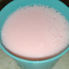 A picture of Roohafza in hot milk.