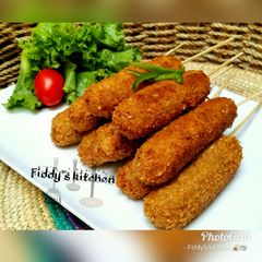 A picture of Yam kebabs with chicken.