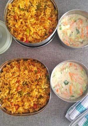 A picture of Veg Masala bhath and Cucumber Carrot Raita.