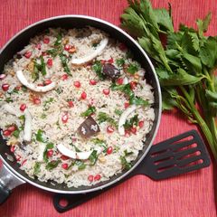 A picture of Tender coconut and pomegranate cheesy pulao.