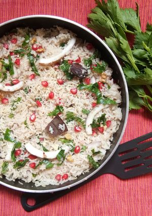 A picture of Tender coconut and pomegranate cheesy pulao.