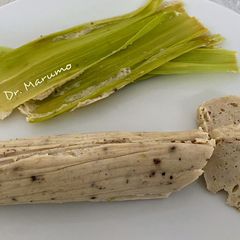A picture of Lemongrass Chicken Rolled in Corn Husks.