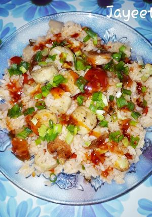 A picture of Chicken Sausage Rice with burnt Garlic and Chilli Oregano Sauce.