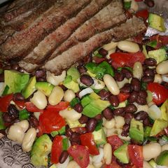 A picture of Grilled Steak Salad with Tomatoes and Avocado.