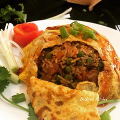 A picture of Omurice (Japanese Fried Rice with Omelette).