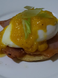 A picture of Eggs Benedict w/ Hollandaise Sauce.