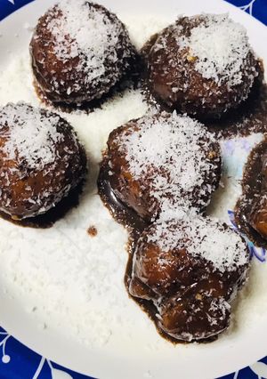 A picture of Baby doughnuts with coconut & chocolate topping.