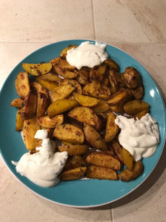 A picture of Healthy and delicious potatoes with sauce (vegetarian).