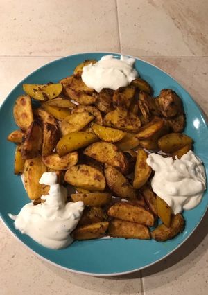 A picture of Healthy and delicious potatoes with sauce (vegetarian).