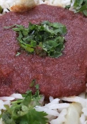 A picture of Patiala pulav with tomato curry.