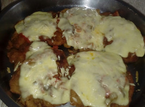 Una foto de Milanesas a la Napolitana con patatas muy crujientes