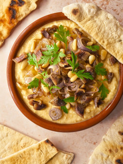 A picture of Hummus With Anchovies, Pine Nuts & Shallots.
