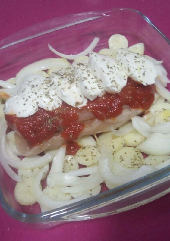Una foto de Versión de pechuga de pollo a la napolitana