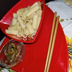 A picture of Pasta and sherreded beef sauce.