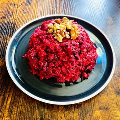 A picture of Beetroot salad with walnuts.