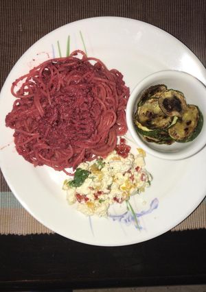A picture of WHEAT SPAGHETTI IN BEETROOT PESTO, FETA CHEESE SALAD,.