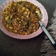 A picture of Beans porridge and ugwu leaves.