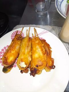 Una foto de Palitos de salchicha y brócoli