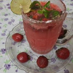 A picture of Fresh strawberry and strawberry crushed mojito.