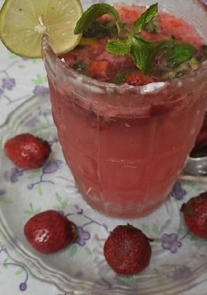 A picture of Fresh strawberry and strawberry crushed mojito.
