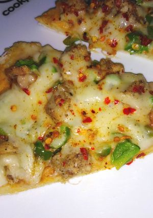 A picture of Chicken pizza with crazy dough.
