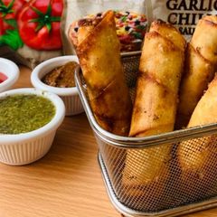 A picture of Chicken and vegetable spring roll.