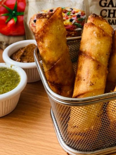 A picture of Chicken and vegetable spring roll.