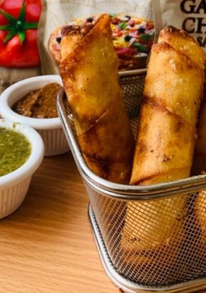A picture of Chicken and vegetable spring roll.