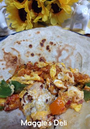 A picture of Egg Burrito with Peppers and Chorizo Queso.