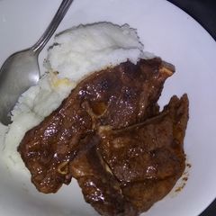 Fried lamb chops with pap A picture of Fried lamb chops with pap.