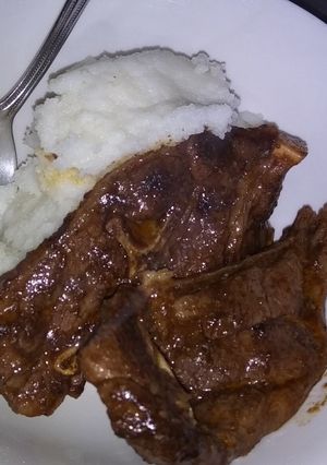 A picture of Fried lamb chops with pap.