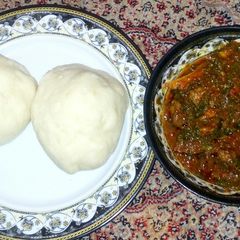 A picture of Pounded yam with pumpkin soup.