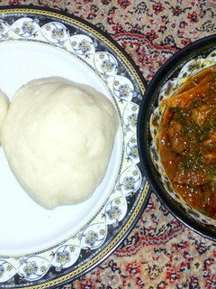 A picture of Pounded yam with pumpkin soup.