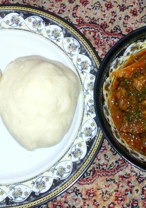 A picture of Pounded yam with pumpkin soup.