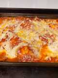 Bake ravioli with salad and cheesy bread