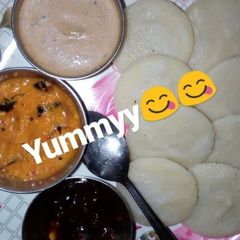 A picture of Poha Idli with three type chutney.