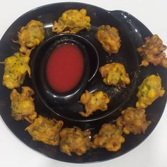 A picture of Crispy corn onion fritters.