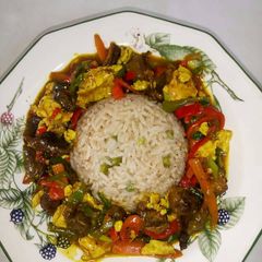 A picture of Rice with curry sauce.