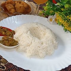 A picture of White rice with aloo Ka salan.