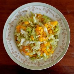 A picture of Mango lettuce salad.