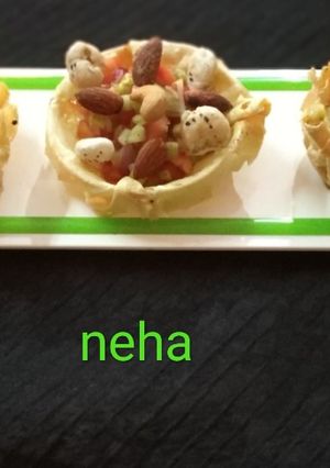 A picture of Masala papad katori chat.