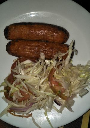 A picture of Cabbage salad with sausage.