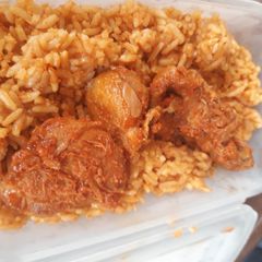 A picture of Jollof rice and beef.