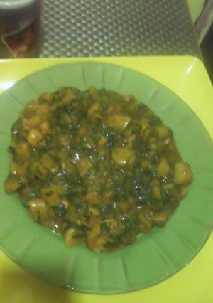 A picture of Unripe plantain porridge with scent leaf and curry leaf.